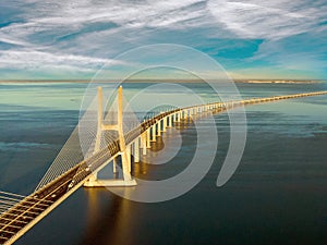 Vasco da Gama Bridge landscape at sunrise. One of the longest bridges in the world. Lisbon is an amazing tourist destination