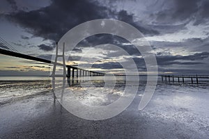 Long bridge over tagus river in Lisbon at sunrise