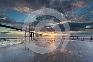 Long bridge over tagus river in Lisbon at sunrise