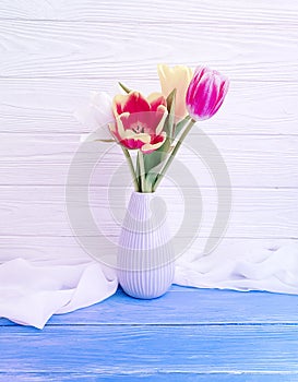 Vase bouquet of tulips decor arrangement home colorful romantic elegance on wooden background