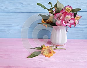 Vase flower alstroemeria on a wooden arrangement