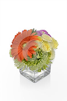 Gerbera Daisy flower arrangement in a vase with yellow Roses. Floral vase arrangement by a florist.