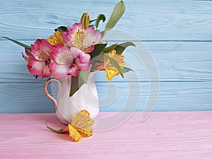 Vase flower fresh spring leaf alstroemeria elegance mother`s day, seasonal on a wooden arrangement