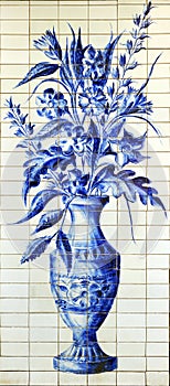 Vase of flowers painted on tiles at the entrance of a Spanish flower shop.