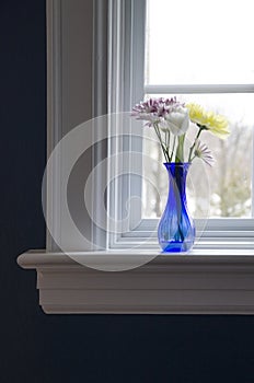 Vase With Flowers on Windowsill