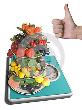 Vase with fruits on weigh-scale photo
