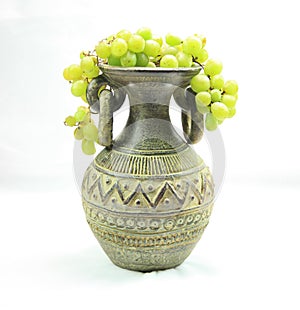 Vase full of grapes