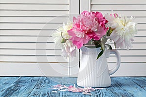 Vase of peony blooms