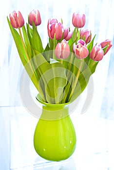 Vase with pink tulip flowers