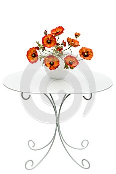 Vase with red poppies is on a coffee table, isolated on a white