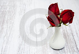 Vase with red roses