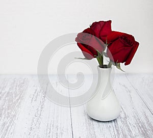Vase with red roses