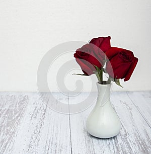 Vase with red roses