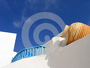 Vase set in whitewashed wall. Santorini, Greece