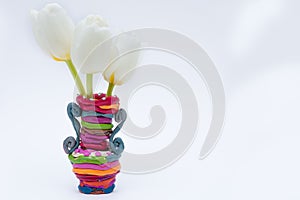 Vase with three white tulips