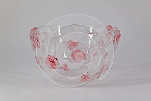 Vase from transparent glass in srozovy flowers