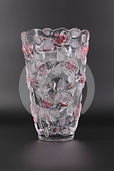 Vase from transparent glass in srozovy flowers