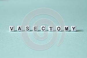 Vasectomy - word concept on cubes