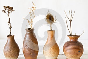 Vases with dried flowers