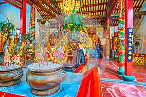 The vases with incense sticks at the Altar of Chinese Leng Buai Ia Shrine in Bangkok, Thailand