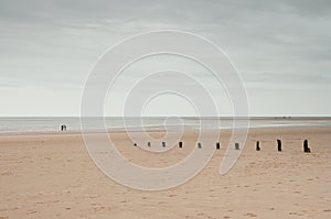 Holkham, Norfolk, UK: Vast empty beach and horizon under winter sky photo