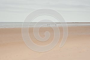 Holkham, Norfolk, UK: Vast empty beach and horizon under winter sky