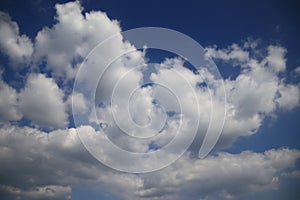 The vast bluesky and clouds for background,Clouds at the middle of the image with copy space,Concept Brightness of the sky