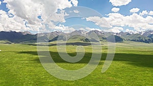 Vast grasslands and mountains in a fine day