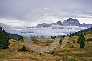 Vast landscape and the Dolomite Mountains in Italy on a cloudy day