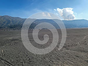 A vast sea of sand known as the whispering sands beneath Mount Bromo, East Java, Indonesia.