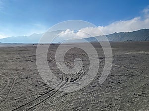 A vast sea of sand known as the whispering sands beneath Mount Bromo, East Java, Indonesia.