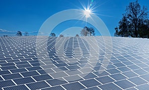 Vast surface of Solar Panels on blue sky with sun