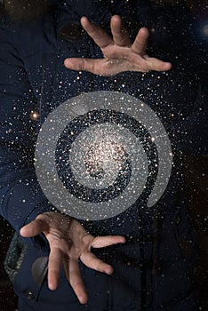 The vast universe in the hands of a child. Elements of this image furnished by NASA.