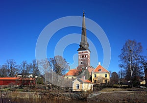 Vasteras Cathedral with old yellow houses in old town