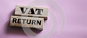 VAT return text Value Added Tax return on wooden blocks. Financial concept