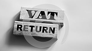 VAT return text Value Added Tax return on wooden blocks. Financial concept