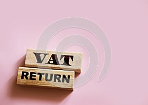 VAT return text Value Added Tax return on wooden blocks. Financial concept