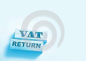 VAT return text Value Added Tax return on wooden blocks. Financial concept