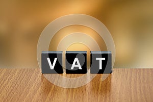 VAT or value added tax on black block photo