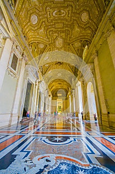 VATICAN, ITALY - JUNE 13, 2015: Spectacular outside hall on Saint Peter Basilica at Vatican, gold covered and marble