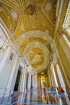 VATICAN, ITALY - JUNE 13, 2015: Spectacular outside hall on Saint Peter Basilica at Vatican, gold covered and marble