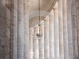 Vatican State, Italy - 21 March 2022: Details of the colonnade in St. Peter's Square in the Vatican state