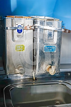 vats of liquids for consumption used by passengers on the Dakota DC-3l passenger plane on the Lisbon/Lourenço Marques route