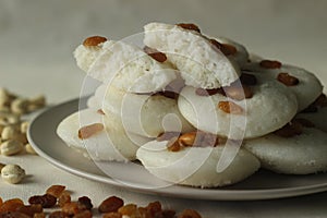Vattappam in Idly shape. Steamed rice cake made of sweet fermented batter of rice and coconut, topped with raisins steamed using