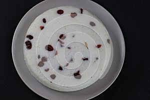 Vattayappam. Steamed spongy rice cake topped with dried cranberries