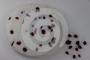 Vattayappam. Steamed spongy rice cake topped with dried cranberries