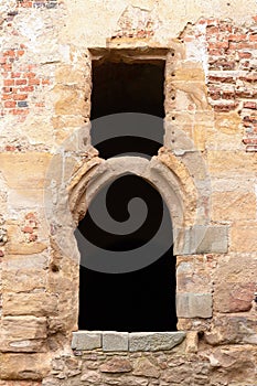 Vaulted Gothic window on the ruins of a Gothic castle photo