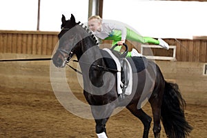 Vaulting on a black horse