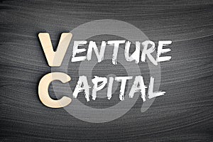 VC - Venture Capital acronym, business concept on blackboard