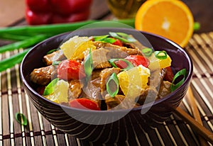 Veal fillet - stir fry with oranges and paprika in sweet and sour sauce